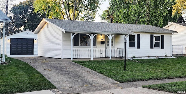2217 Ramsey Ave, Springfield, IL 62702 - single story home with a porch, driveway, a garage, an outbuilding, and a front lawn