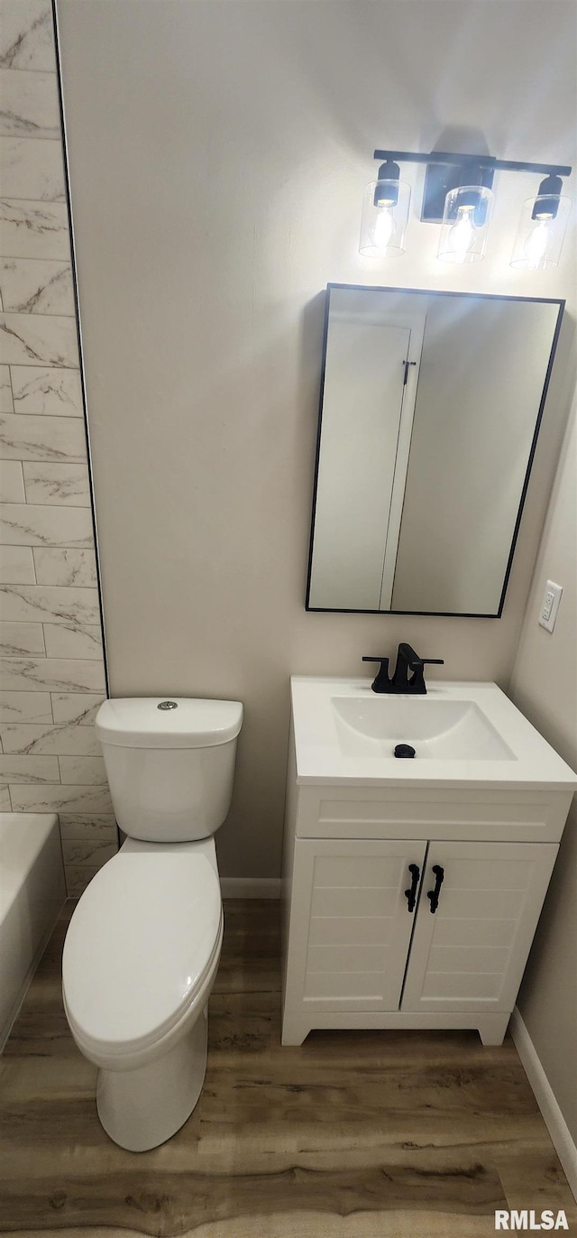 2217 Ramsey Ave, Springfield, IL 62702 - full bathroom featuring vanity, wood finished floors, and a bath