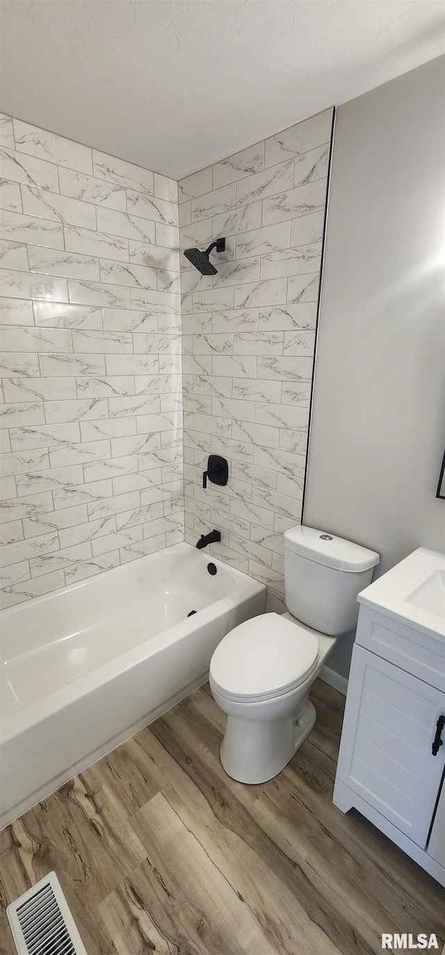 2217 Ramsey Ave, Springfield, IL 62702 - full bathroom with tub / shower combination, wood finished floors, and vanity