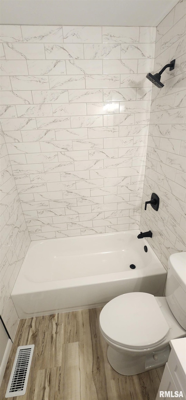 2217 Ramsey Ave, Springfield, IL 62702 - full bath featuring shower / bath combination, wood finished floors, and vanity