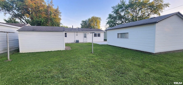 2217 Ramsey Ave, Springfield, IL 62702 - rear view of property with a lawn and a shed