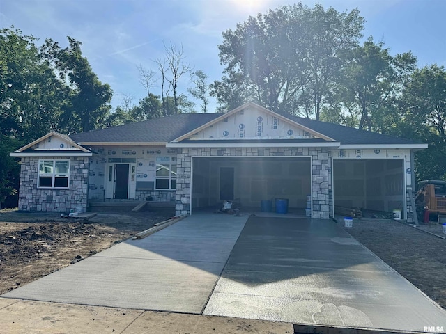 604 Rock River Rd, Springfield, IL 62711 - property under construction with a garage, stone siding, and concrete driveway