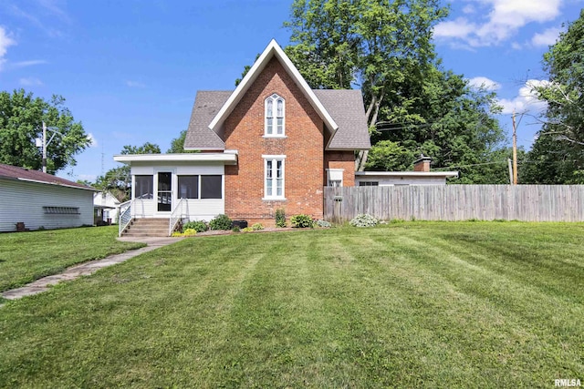 508 N Washington St, Mount Pulaski, IL 62548 - view of front of house with a sunroom, brick siding, and a shingled roof
