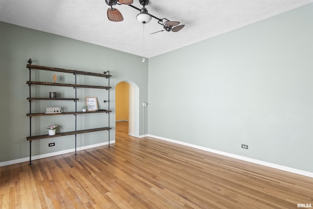 508 N Washington St, Mount Pulaski, IL 62548 - spare room featuring arched walkways and wood finished floors