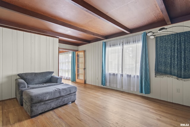 508 N Washington St, Mount Pulaski, IL 62548 - living area featuring beam ceiling, plenty of natural light, and wood finished floors