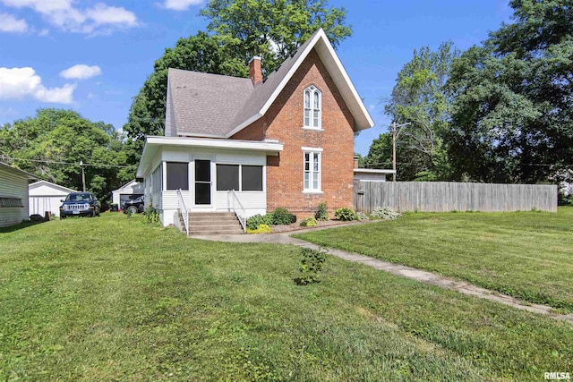 508 N Washington St, Mount Pulaski, IL 62548 - view of front facade with brick siding, entry steps, and a chimney