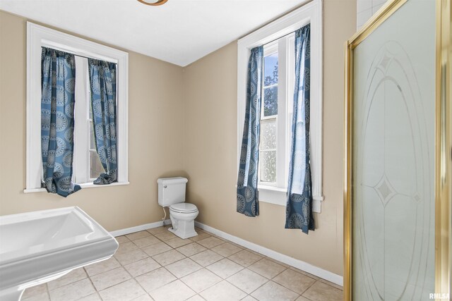 508 N Washington St, Mount Pulaski, IL 62548 - bathroom featuring baseboards and tile patterned floors