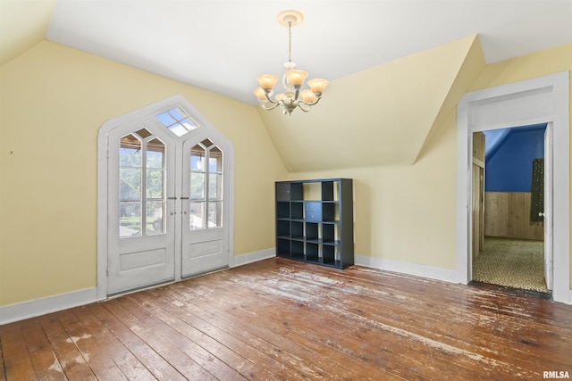 508 N Washington St, Mount Pulaski, IL 62548 - entryway with hardwood / wood-style flooring, vaulted ceiling, a chandelier, and french doors