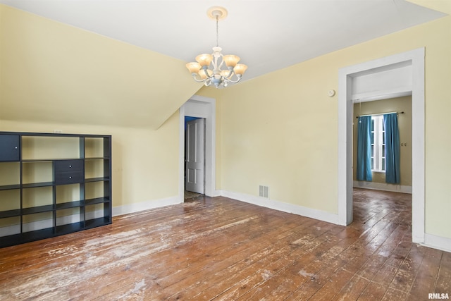 508 N Washington St, Mount Pulaski, IL 62548 - spare room with a chandelier, hardwood / wood-style floors, and lofted ceiling
