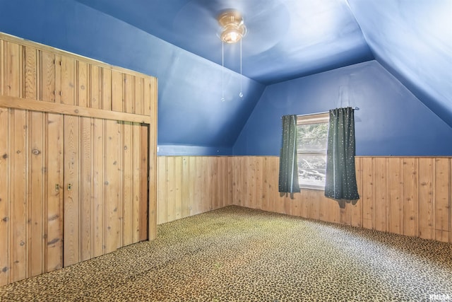 508 N Washington St, Mount Pulaski, IL 62548 - bonus room featuring vaulted ceiling, wood walls, a wainscoted wall, and carpet