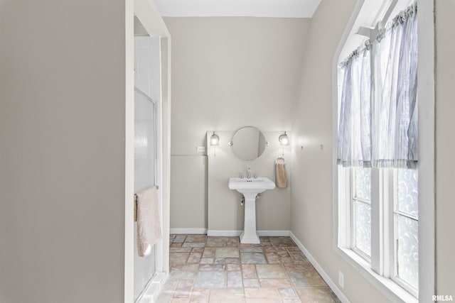 508 N Washington St, Mount Pulaski, IL 62548 - bathroom featuring baseboards and stone finish floors