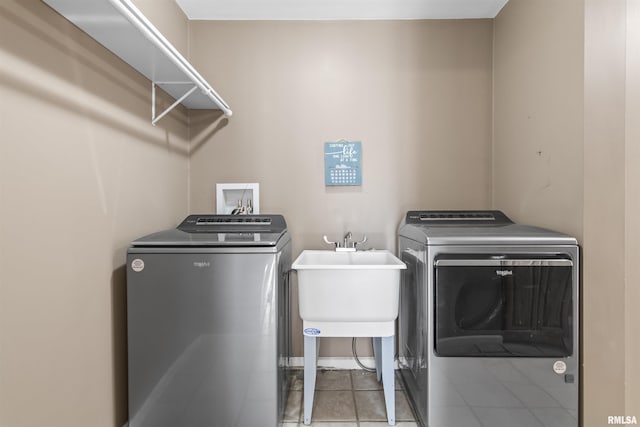 508 N Washington St, Mount Pulaski, IL 62548 - laundry area featuring washer and clothes dryer and tile patterned flooring