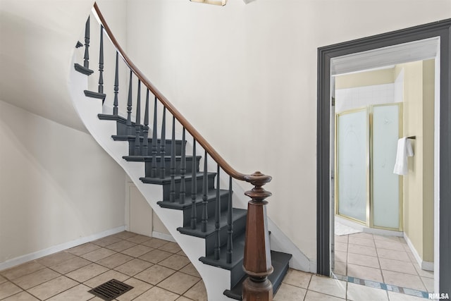 508 N Washington St, Mount Pulaski, IL 62548 - staircase with tile patterned flooring and baseboards
