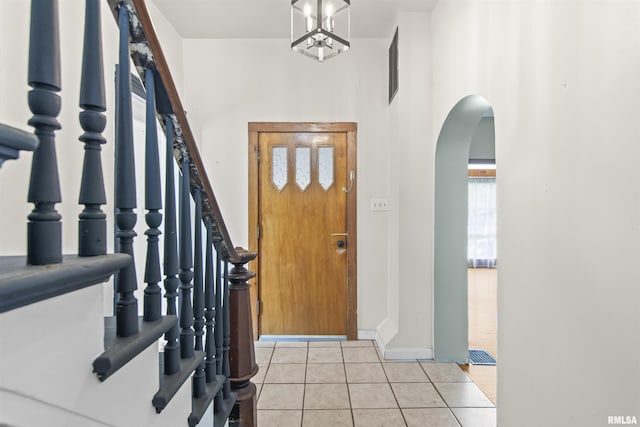 508 N Washington St, Mount Pulaski, IL 62548 - foyer entrance with arched walkways and light tile patterned floors