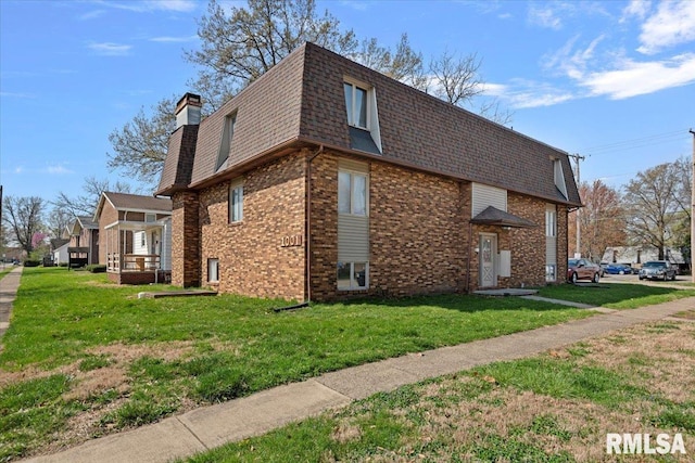 102 W Scarritt St, Springfield, IL 62704 - view of property exterior with roof with shingles, brick siding, mansard roof, and a yard