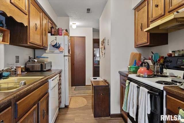 102 W Scarritt St, Springfield, IL 62704 - kitchen featuring range with electric stovetop, under cabinet range hood, brown cabinets, dark wood-style flooring, and dishwasher