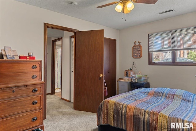102 W Scarritt St, Springfield, IL 62704 - bedroom featuring light colored carpet, a textured ceiling, and ceiling fan
