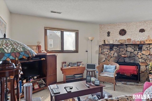 102 W Scarritt St, Springfield, IL 62704 - living area with carpet floors, a textured ceiling, and a stone fireplace