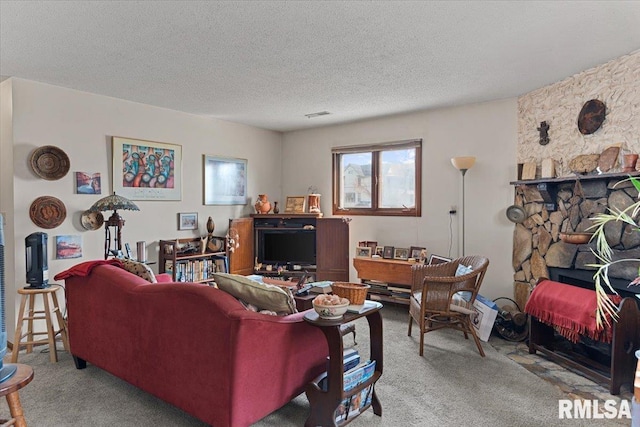 102 W Scarritt St, Springfield, IL 62704 - living room featuring carpet floors, a fireplace, and a textured ceiling