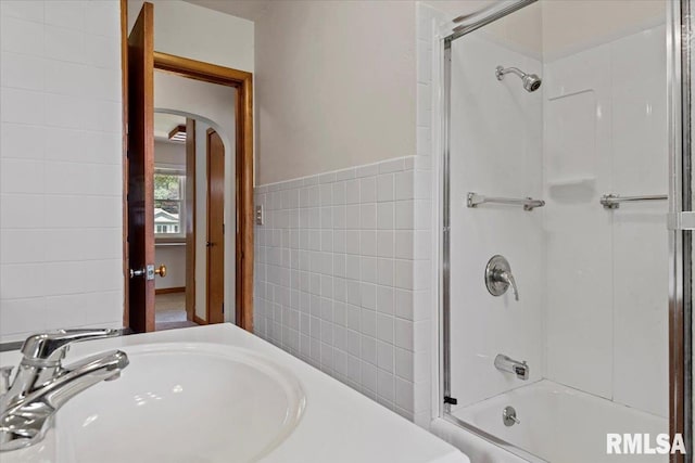 1640 W Glenn Ave, Springfield, IL 62704 - bathroom featuring tile walls and combined bath / shower with glass door