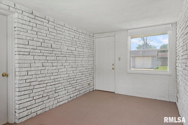 1640 W Glenn Ave, Springfield, IL 62704 - foyer featuring brick wall and carpet