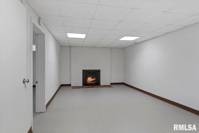 1640 W Glenn Ave, Springfield, IL 62704 - unfurnished living room featuring a brick fireplace and a drop ceiling