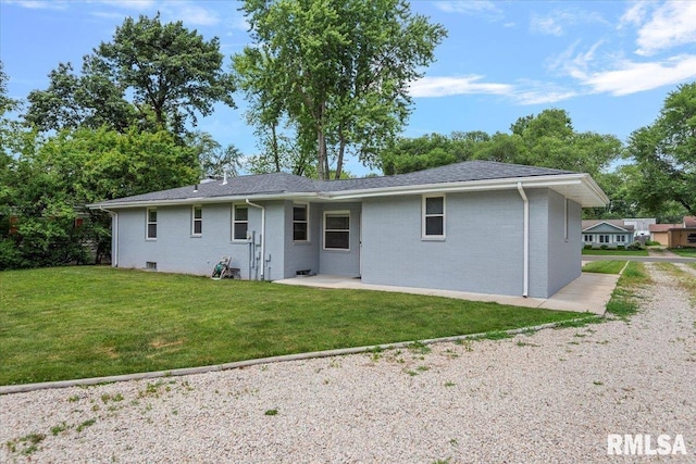 1640 W Glenn Ave, Springfield, IL 62704 - rear view of house featuring a yard, brick siding, and a patio area