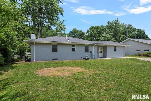 1640 W Glenn Ave, Springfield, IL 62704 - rear view of property with a chimney, a lawn, and brick siding