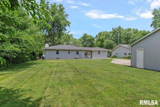 1640 W Glenn Ave, Springfield, IL 62704 - back of property featuring a lawn and a chimney