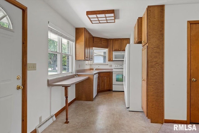 1640 W Glenn Ave, Springfield, IL 62704 - kitchen with white appliances, brown cabinetry, light countertops, and baseboard heating
