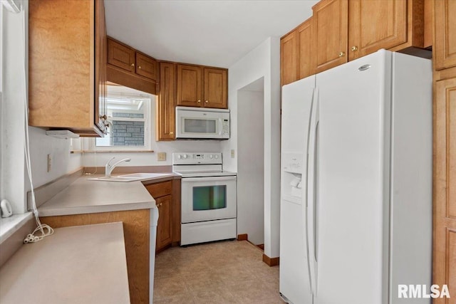 1640 W Glenn Ave, Springfield, IL 62704 - kitchen featuring white appliances, light countertops, and brown cabinetry