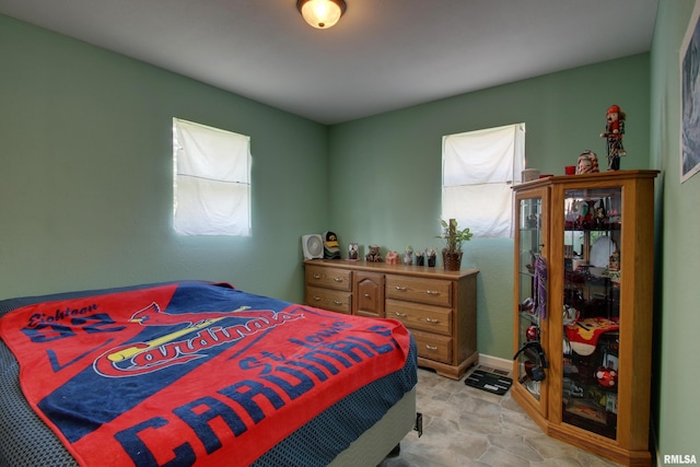 461 Oak St, Hamilton, IL 62341 - bedroom with multiple windows and light stone finish floors