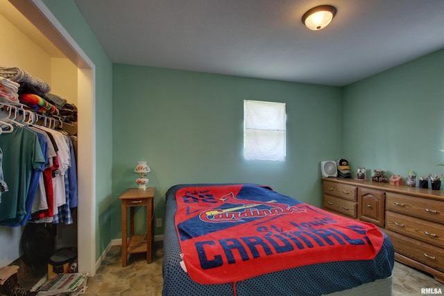 461 Oak St, Hamilton, IL 62341 - bedroom featuring a closet, stone finish floors, and a walk in closet