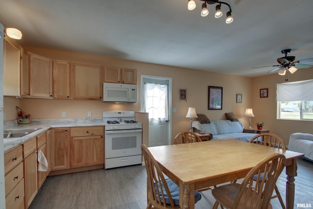 461 Oak St, Hamilton, IL 62341 - kitchen featuring white appliances, light brown cabinets, and light wood-style flooring