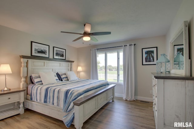 1521 Silverthorne Dr, Quincy, IL 62305 - bedroom featuring wood finished floors and a ceiling fan