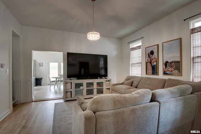 2117 Hampshire St, Quincy, IL 62301 - living room featuring a chandelier and light wood-style flooring