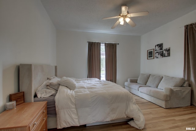 2117 Hampshire St, Quincy, IL 62301 - bedroom with light wood-style floors, ceiling fan, and a textured ceiling