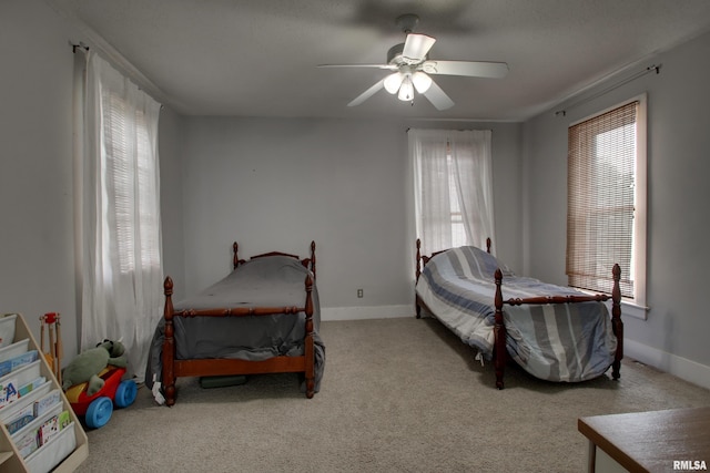 2117 Hampshire St, Quincy, IL 62301 - carpeted bedroom featuring multiple windows and a ceiling fan