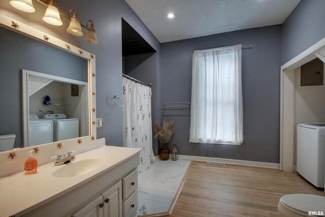 2117 Hampshire St, Quincy, IL 62301 - bathroom with washer and clothes dryer, vanity, electric panel, wood finished floors, and recessed lighting