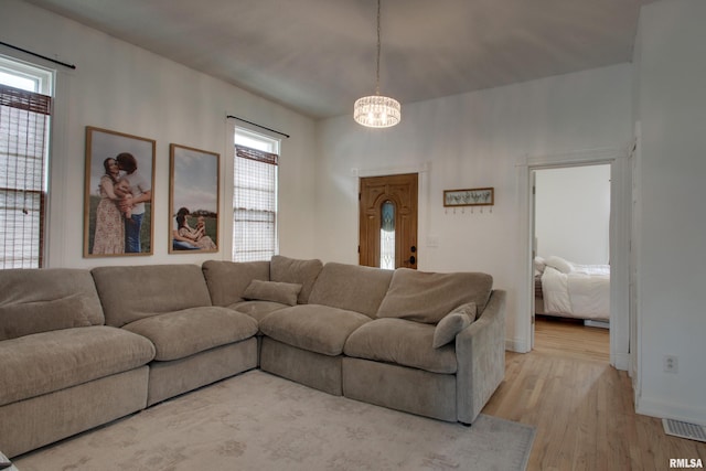 2117 Hampshire St, Quincy, IL 62301 - living area with a chandelier and light wood-style floors