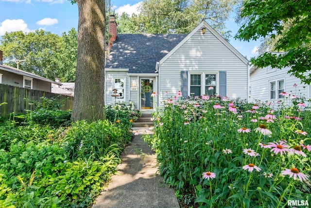 1935 S Douglas Ave, Springfield, IL 62704 - view of front facade with a chimney and a shingled roof