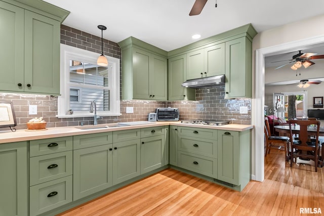 1935 S Douglas Ave, Springfield, IL 62704 - kitchen featuring a ceiling fan, light wood-type flooring, light countertops, and decorative light fixtures