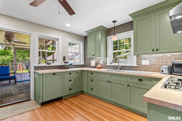 1935 S Douglas Ave, Springfield, IL 62704 - kitchen featuring green cabinets, a ceiling fan, light wood finished floors, stainless steel gas stovetop, and recessed lighting