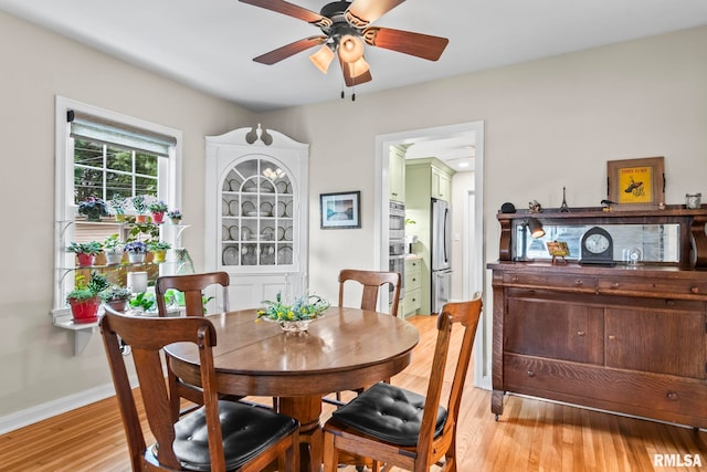 1935 S Douglas Ave, Springfield, IL 62704 - dining area with a ceiling fan and light wood-type flooring