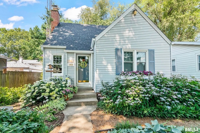 1935 S Douglas Ave, Springfield, IL 62704 - view of front of home featuring a chimney and roof with shingles