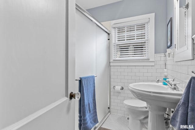 1935 S Douglas Ave, Springfield, IL 62704 - bathroom with a stall shower, tile patterned floors, and tile walls