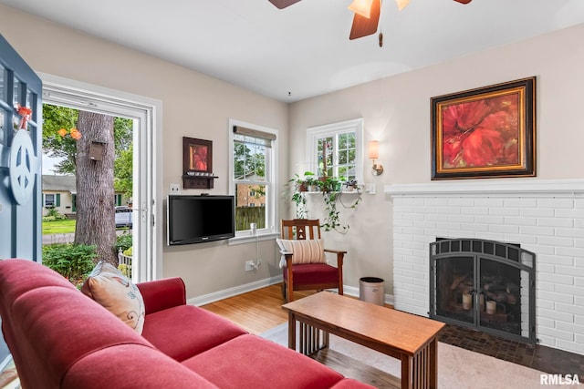 1935 S Douglas Ave, Springfield, IL 62704 - living area featuring healthy amount of natural light, ceiling fan, wood finished floors, and a fireplace