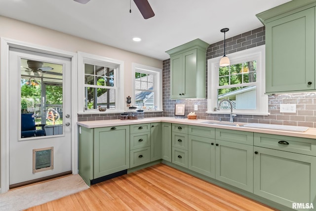 1935 S Douglas Ave, Springfield, IL 62704 - kitchen with a ceiling fan, green cabinetry, light wood-type flooring, and light countertops