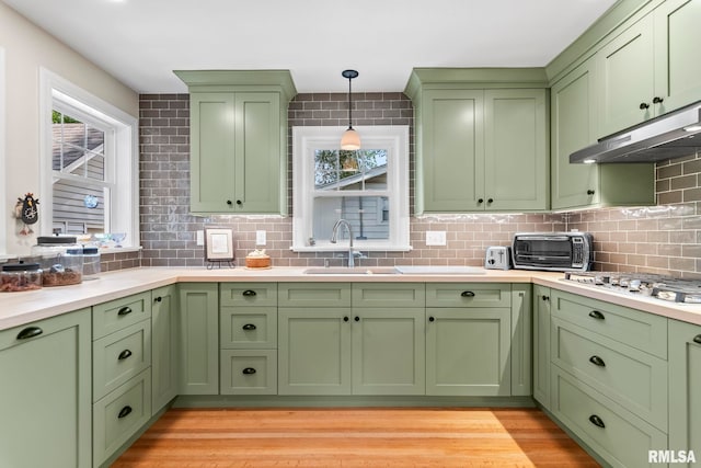 1935 S Douglas Ave, Springfield, IL 62704 - kitchen with green cabinets and under cabinet range hood
