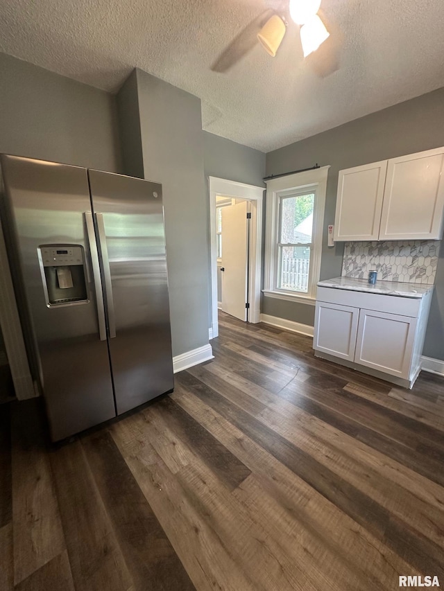 1249 W Urban Ave, Springfield, IL 32704 - kitchen featuring stainless steel fridge with ice dispenser, white cabinetry, light countertops, dark wood finished floors, and ceiling fan